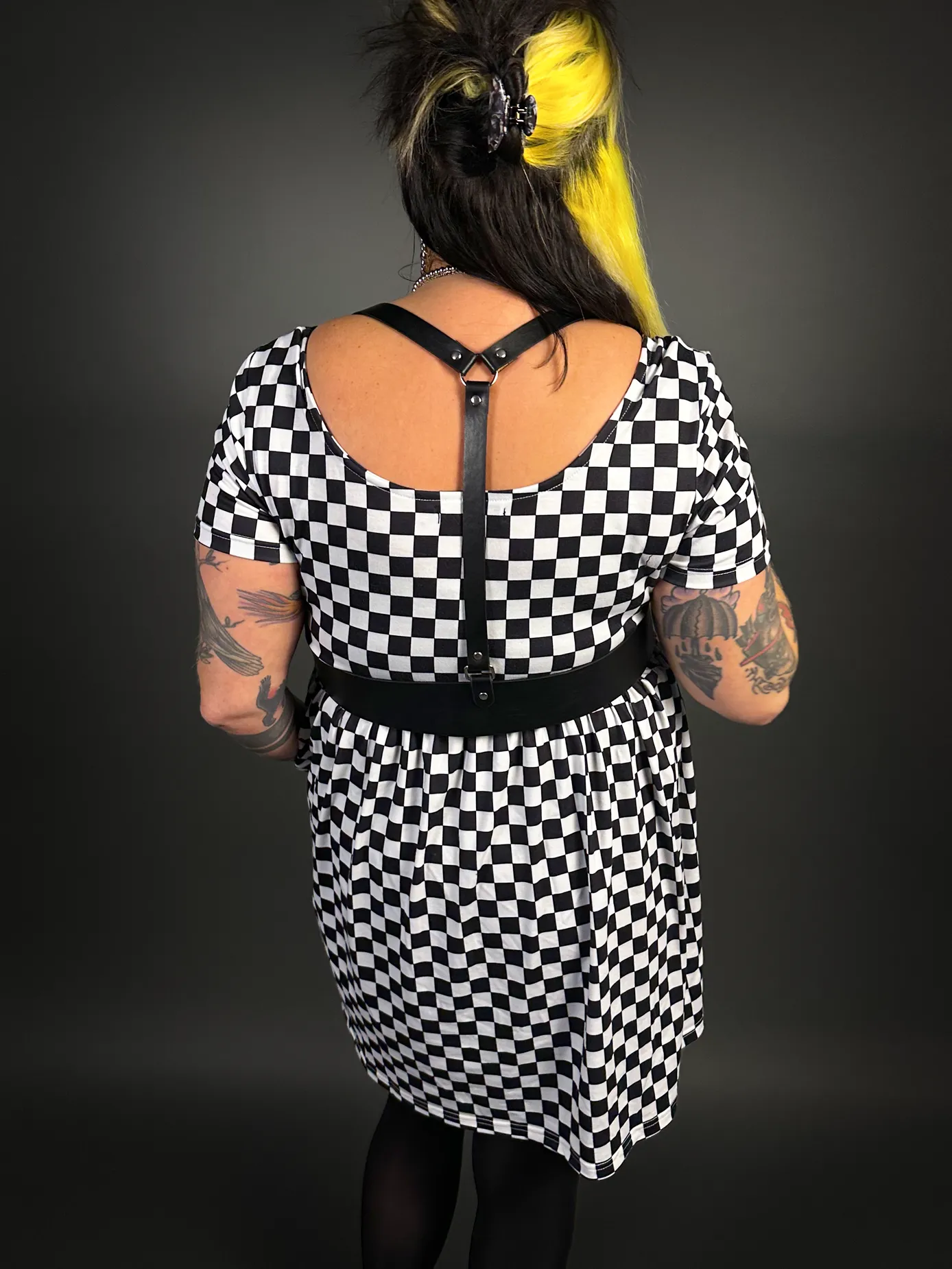 Stylish Checkered Skater Dress with Classic Black Shoulder Harness Belt