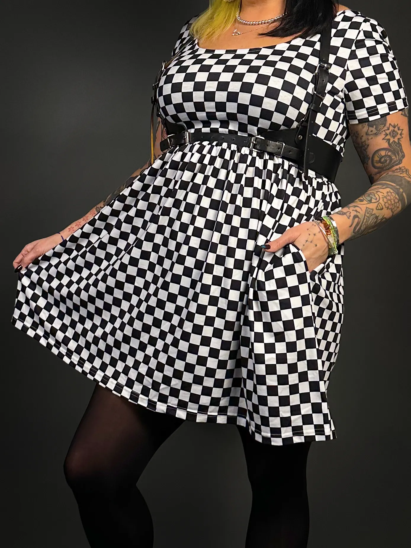 Stylish Checkered Skater Dress with Classic Black Shoulder Harness Belt