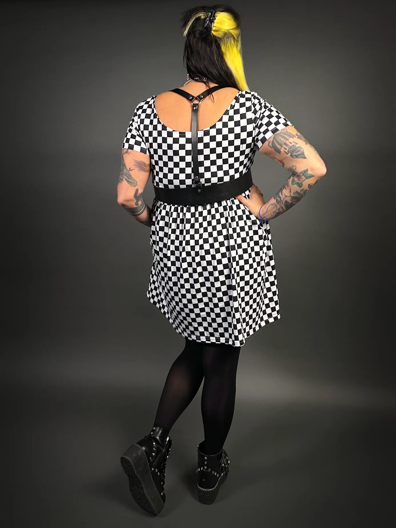 Stylish Checkered Skater Dress with Classic Black Shoulder Harness Belt